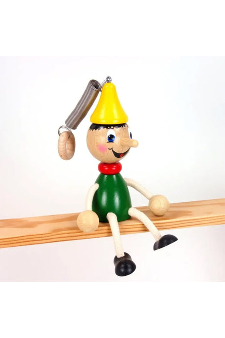 Holzfigur Pinochio baumelnd