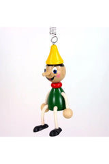 Holzfigur Pinochio baumelnd